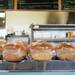 Loafs of white and wheat bread line the counter. Dimo's Deli and Donuts makes all of their bread in house. Melanie Maxwell | AnnArbor.com